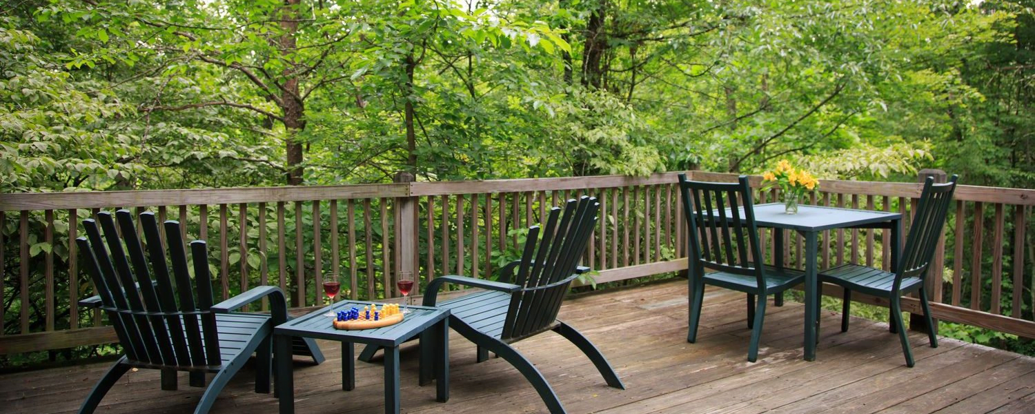 chairs on a deck in the woods