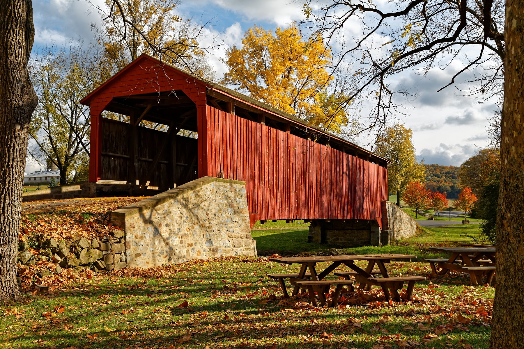 red covered bridge in autumn