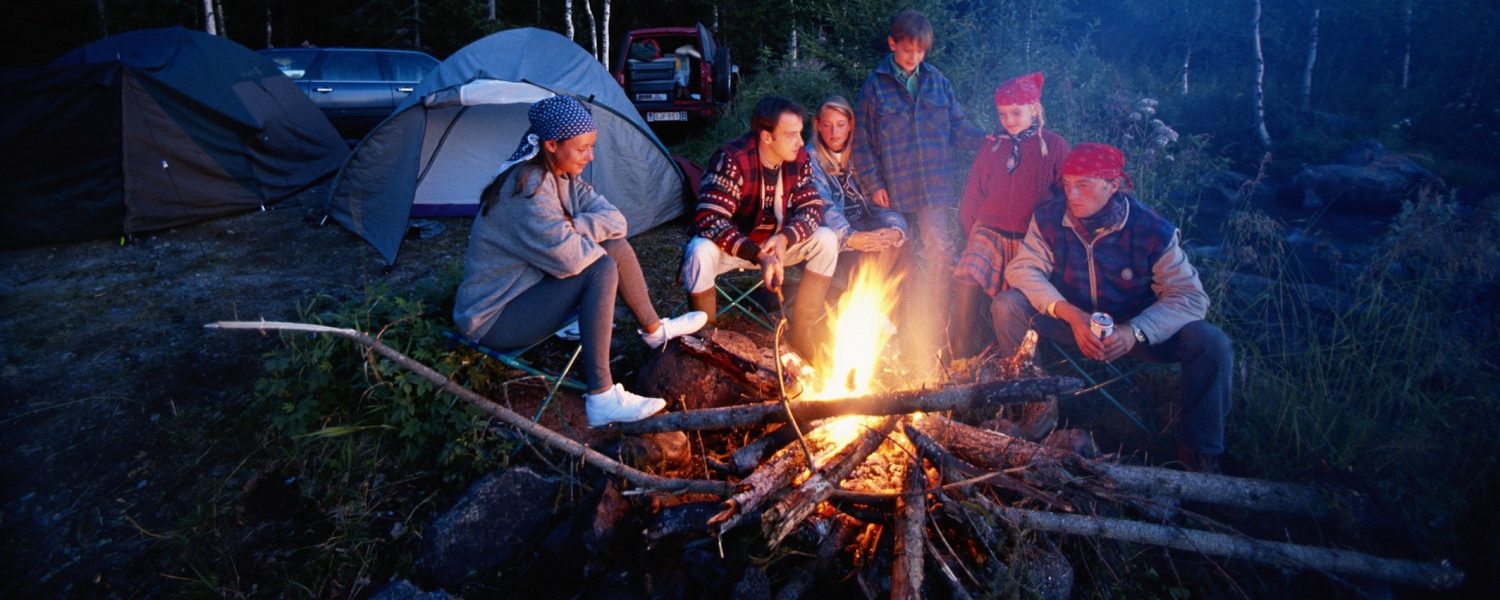 Group of people around campfire