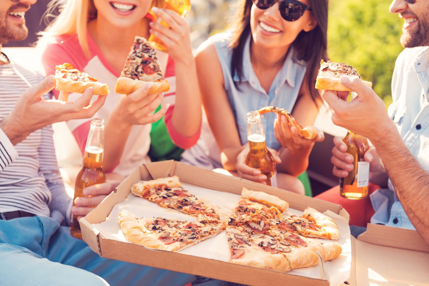 people enjoying pizza outside in Logan, Ohio