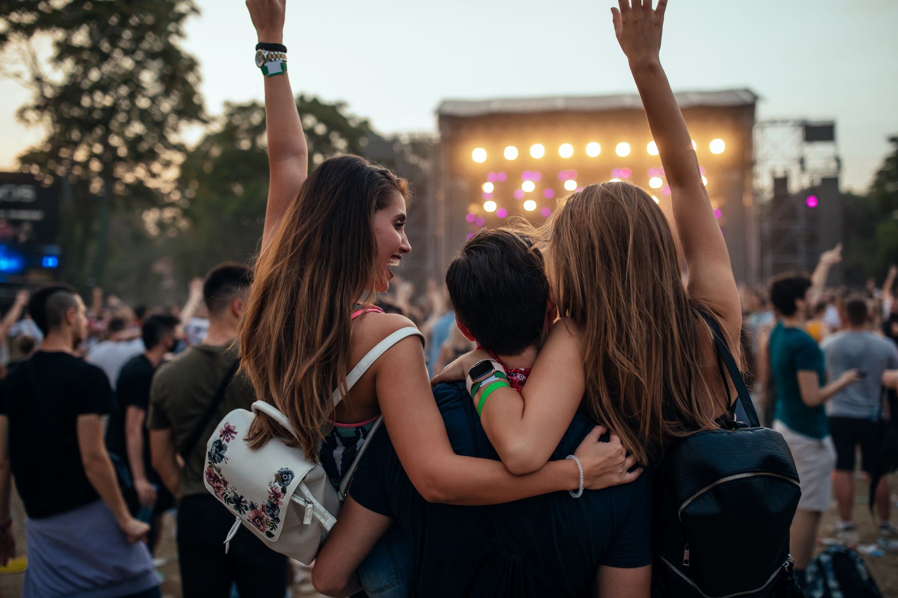 Group of people at an outdoor music festival.